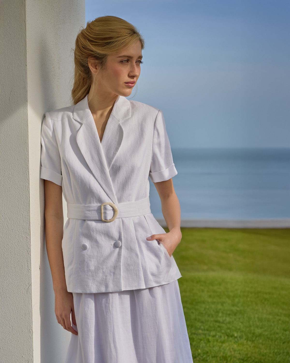 Woman in a white short-sleeve suit and skirt - Dunnes Stores summer white collection for women